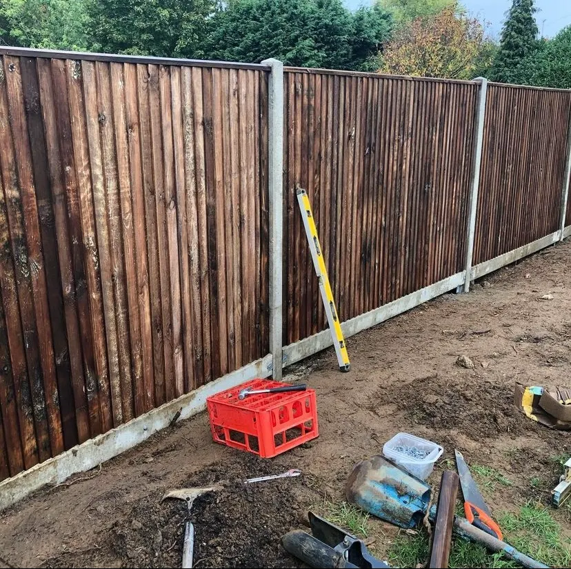 Timber fencing installed between a garden and neighbouring plot