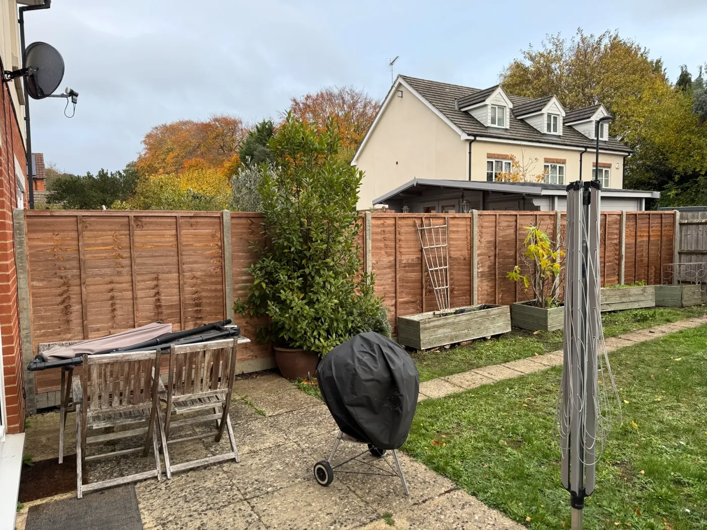 Newly installed timber fence line along a rear garden boundary