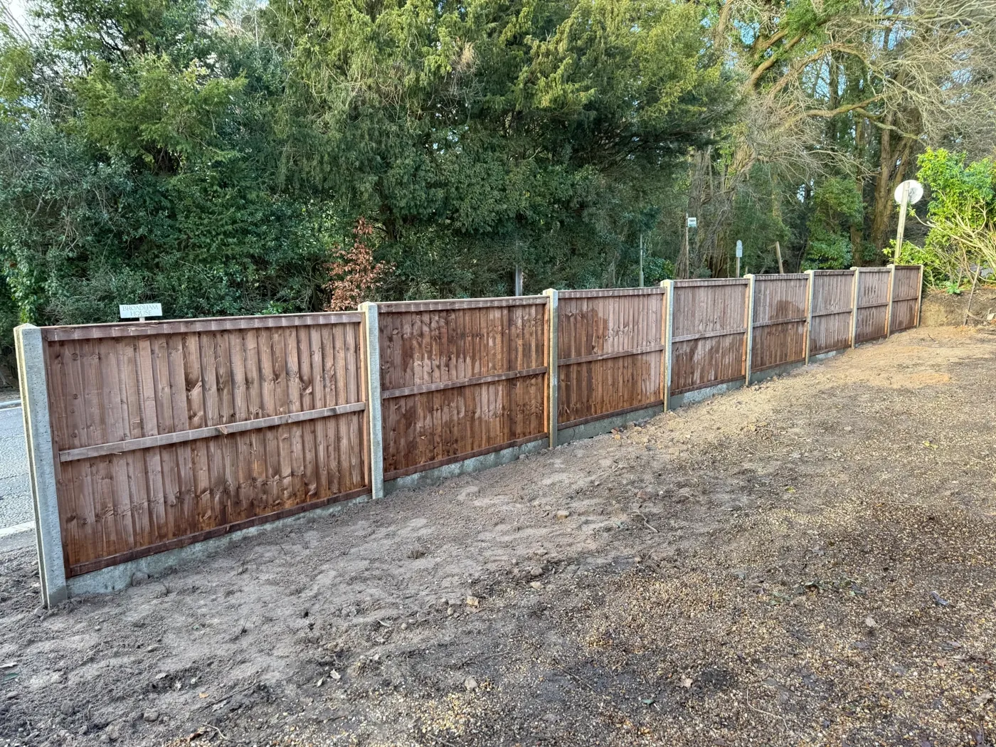 Completed timber fencing project beside a lawn