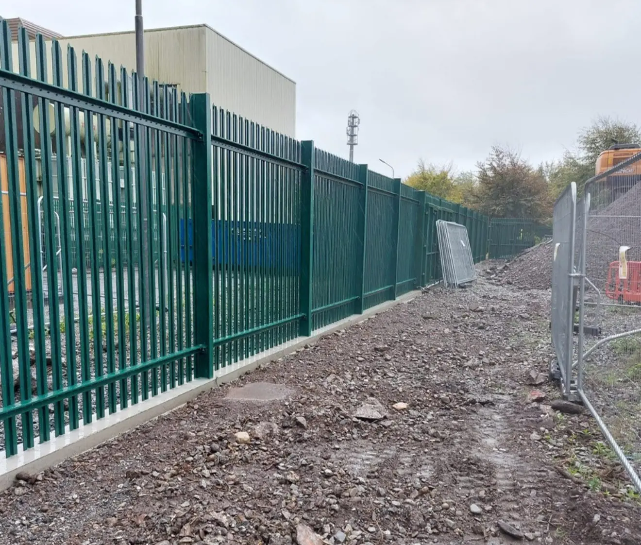 Commercial perimeter mesh fencing around a compound