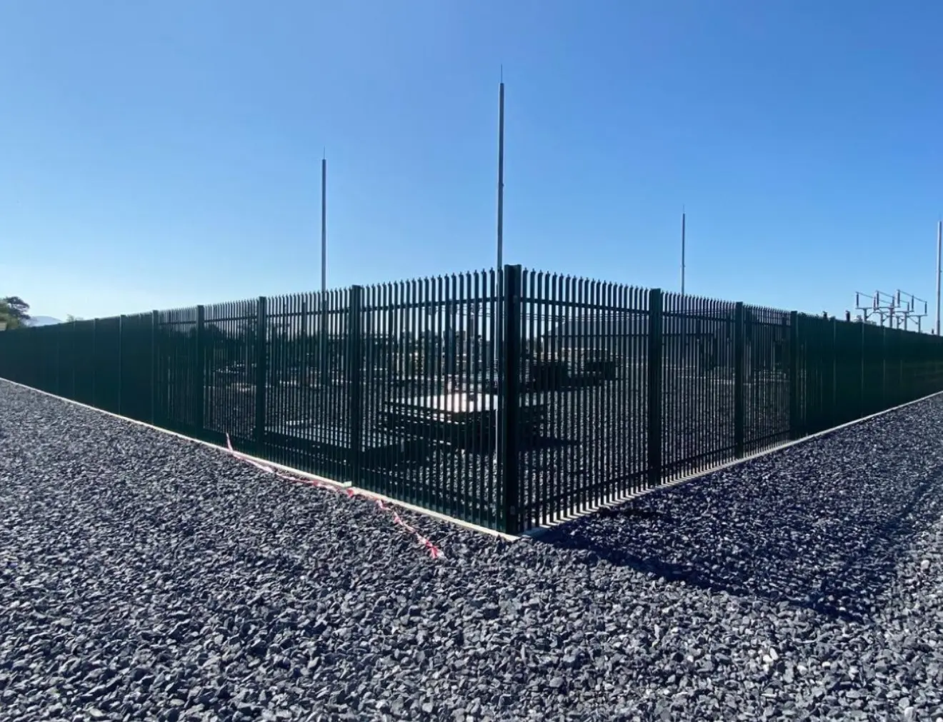 Steel security fencing with lockable gate on a business site