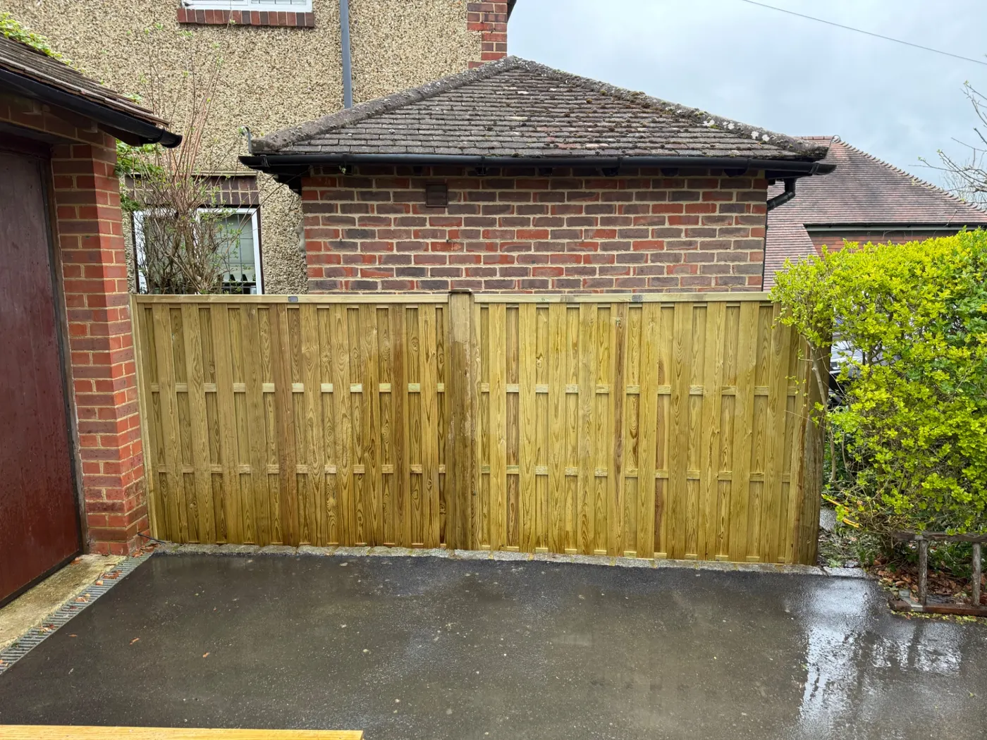 Tongue and groove double driveway gates hung on heavy posts