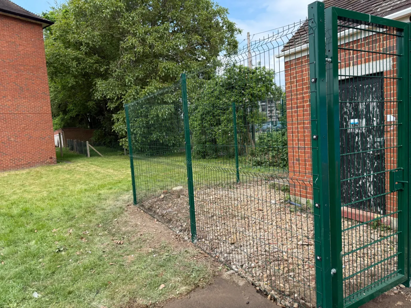 V-mesh security fencing with a lockable pedestrian gate