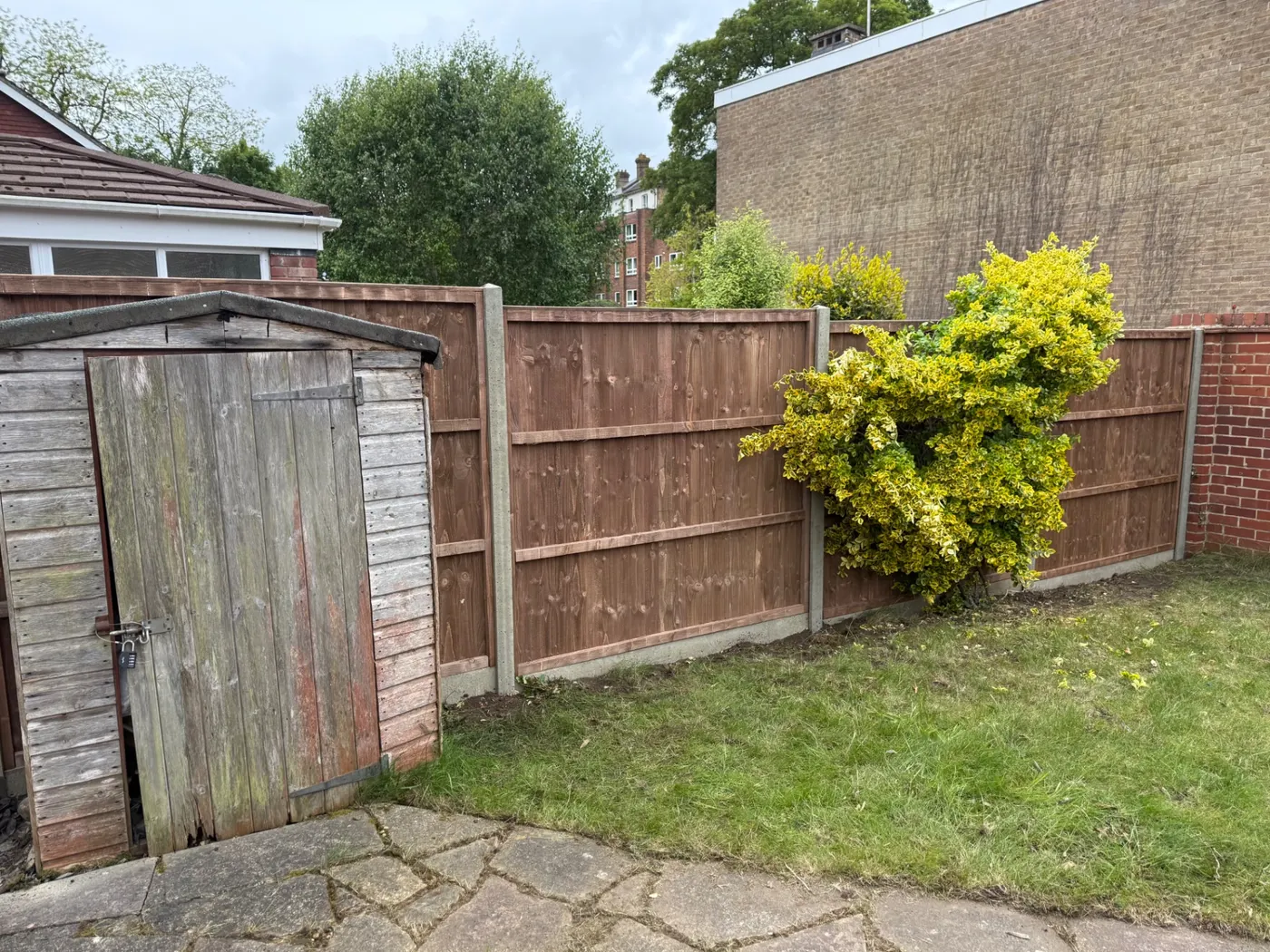 Replacement closeboard panels fitted into concrete posts