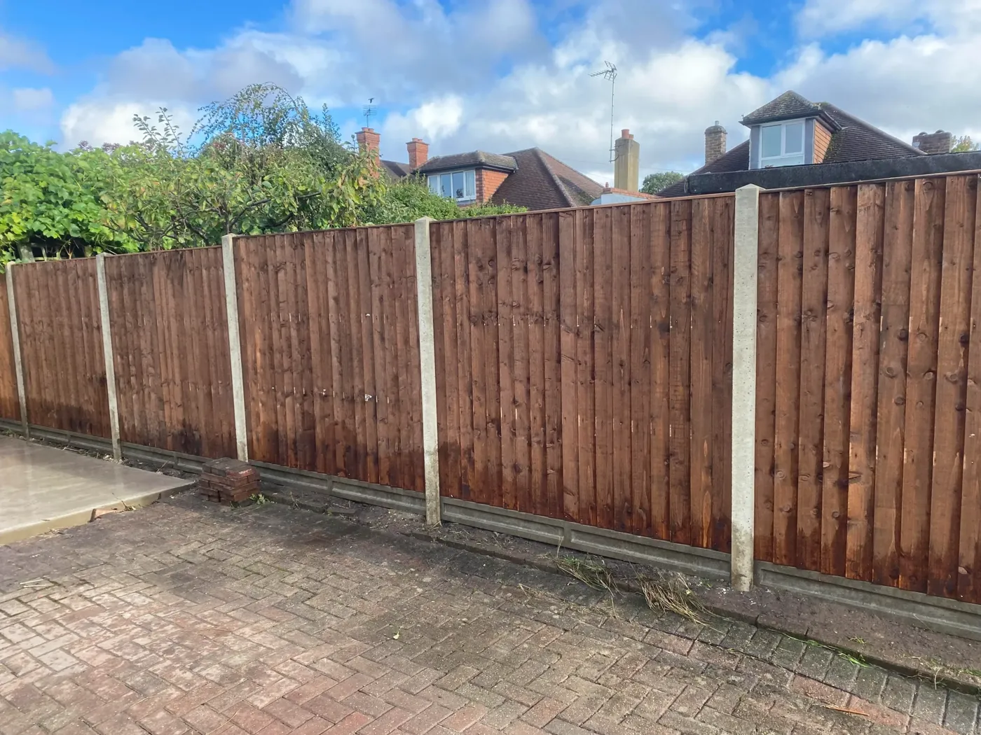 Closeboard panel fencing with gravel boards and concrete posts
