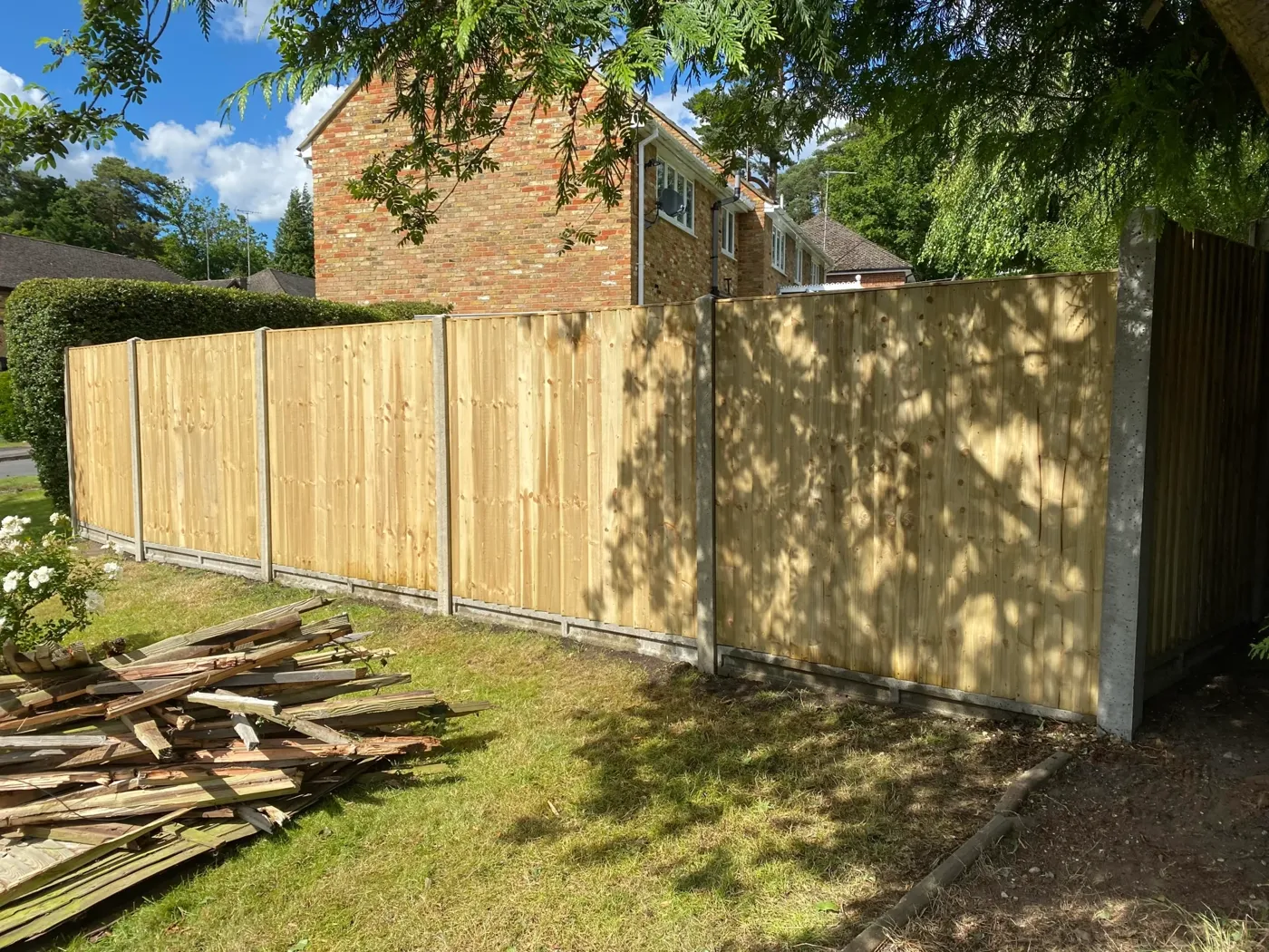 New timber fence installed along a side boundary